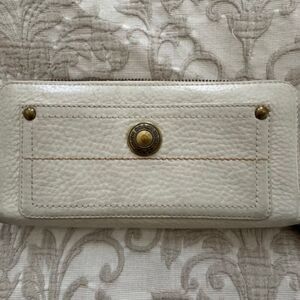 Coach Ivory Pebble leather zip around continental wallet.